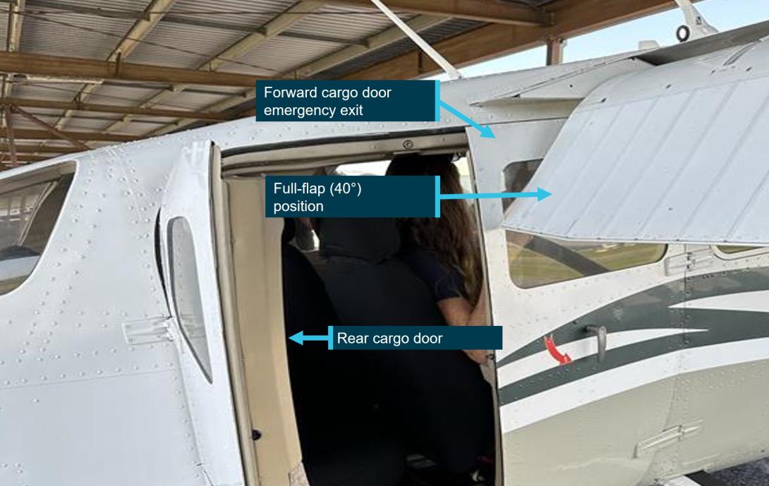 Cargo door with flap extended to the 40 degree position clearly blocking the forward cargo door from opening.