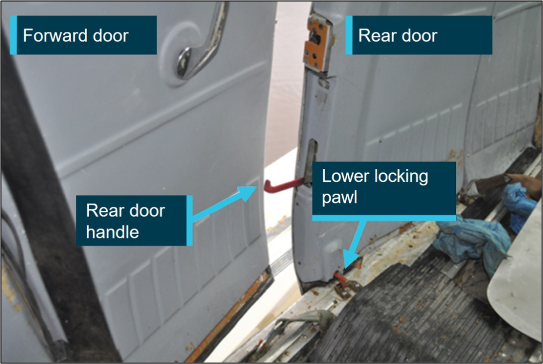 Internal image of the Cessna 206G cargo doors slightly opened. The image shows the rear door handle in the open position.  