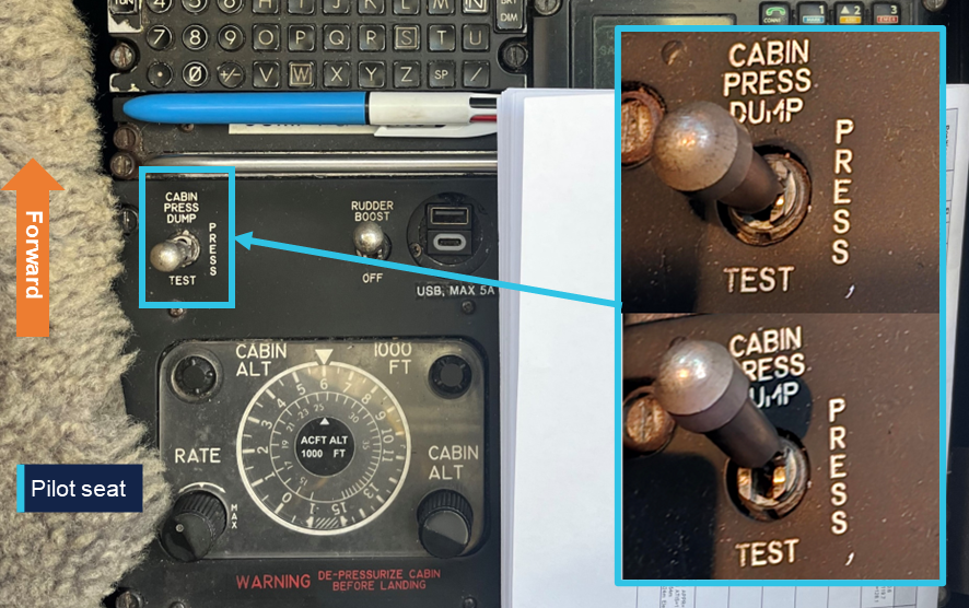 Image showing the location of the cabin pressure dump switch adjacent to the pilot seat on the centre console and the switch position in both the pressurised and dump positions.