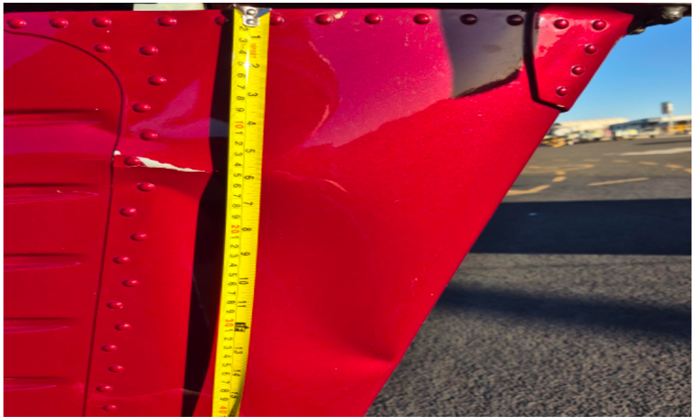 Photograph of crease in lower stabiliser of AS 350 B2 helicopter